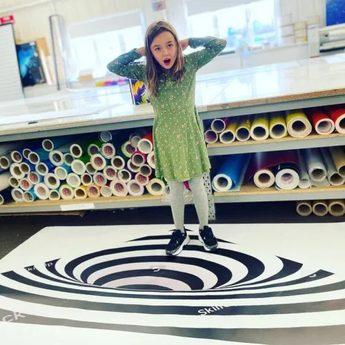 Girl amazed by floor graphics
